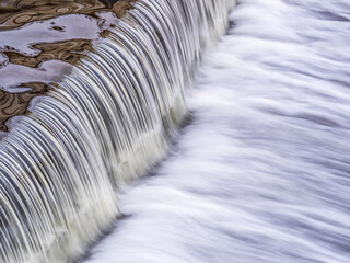 A small flat cascade in a calm river