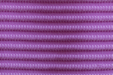 Closeup of lilac corduroy cloth as patterned textured background