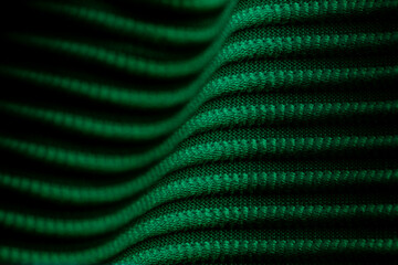 Closeup of green corduroy cloth as patterned textured background