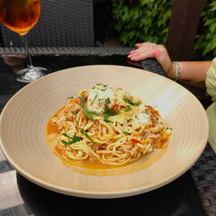 Plate of crab linguine garnished with parsley.