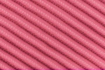 Closeup of pink corduroy cloth as patterned textured background