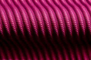 Closeup of pink corduroy cloth as patterned textured background