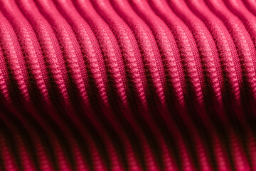 Closeup of pink corduroy cloth as patterned textured background