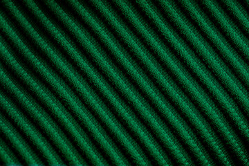 Closeup of green corduroy cloth as patterned textured background