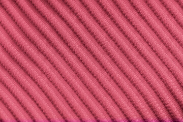 Closeup of pink corduroy cloth as patterned textured background