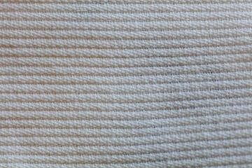 Closeup of white corduroy cloth as patterned textured background