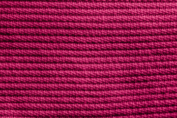 Closeup of pink corduroy cloth as patterned textured background