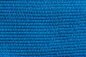 Closeup of blue corduroy cloth as patterned textured background