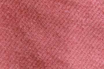 Closeup of pink corduroy cloth as patterned textured background