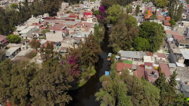 Aerial Drone shot of Xochimilco District in Mexico CIty, Famous by Colorful boats in floating gardens in CDMX, Mexico