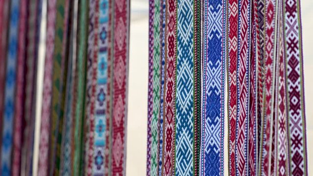 Details of a traditional colorful Lithuanian weave. Woven belts as a part of national Lithuanian costume sold on traditional Easter fair in Vilnius, Lithuania