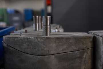 Closeup view of shoe lasts at factory workshop.