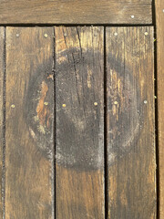 Dirty circle left on wooden deck from flower pot