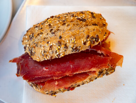Appetizing ham sandwich served for breakfast on platter