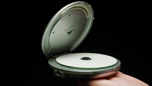 Vintage cd music player close-up. Using portable music player for listening with compact disc