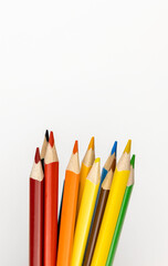 A set of coloured pencils on the table. The concept of leisure and spending free time.