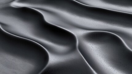 Smooth black waves with light reflections, creating a sleek and modern visual effect.