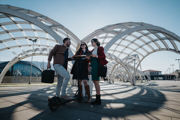 Three businesspeople engaged in a discussion outdoors with innovative architecture in the background.