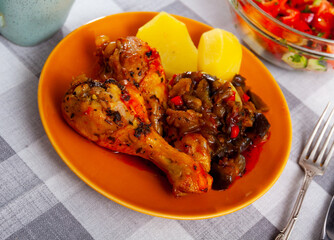 Baked chicken legs with stewed vegetables and boiled potatoes