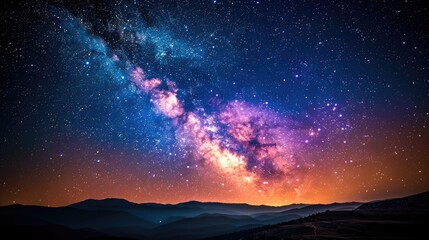 Fototapeta premium A beautiful night sky with a large, glowing cloud of milk. The sky is filled with stars and the moon is barely visible. The scene is peaceful and serene, with the stars twinkling in the darkness
