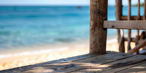Fototapeta premium Close-up Empty Wooden balcony of a luxurious hotel resort with a view of a paradise beach with blue water. 