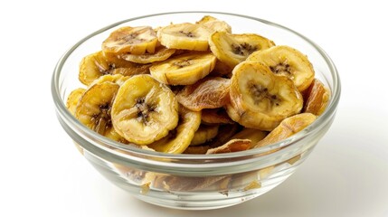 Sun-dried bananas in glass bowl on white background.