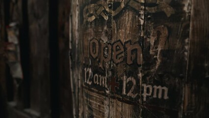Carved Elegance: Close-Up of Intricate Wooden Open Sign for Notable Restaurant