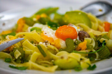 Traditional capeletti soup with chicken and vegetables. Typical winter dinner soup