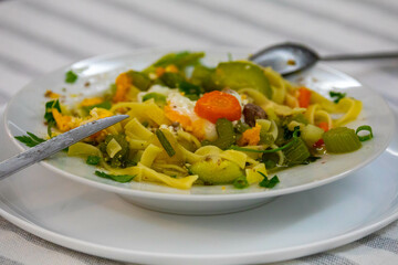 Traditional capeletti soup with chicken and vegetables. Typical winter dinner soup