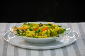 Traditional capeletti soup with chicken and vegetables. Typical winter dinner soup