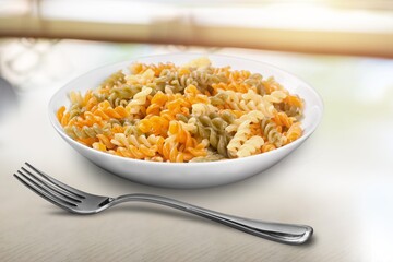 Tasty fresh pasta noodles dish with sauce and cheese