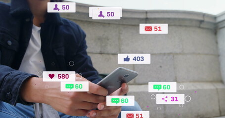 Image of media icons over biracial man using smartphone