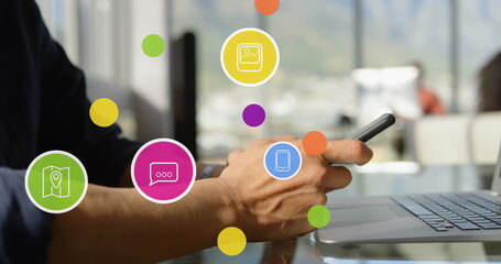 Image of media icons over caucasian man using smartphone