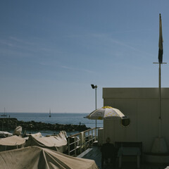 a row of umbrellas on the beach