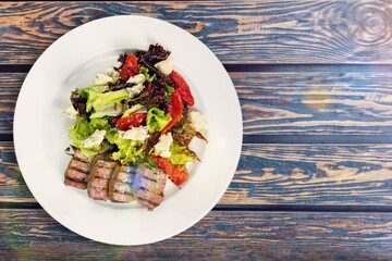 Barbecue grilled beef meat on a plate.