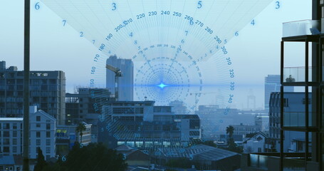Image of data processing spinning around blue light spot against aerial view of cityscape