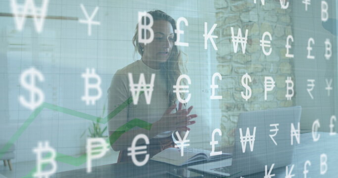 Image of data processing and currency symbols over biracial woman using laptop