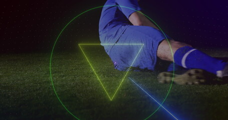 Image of neon shapes over caucasian male soccer player
