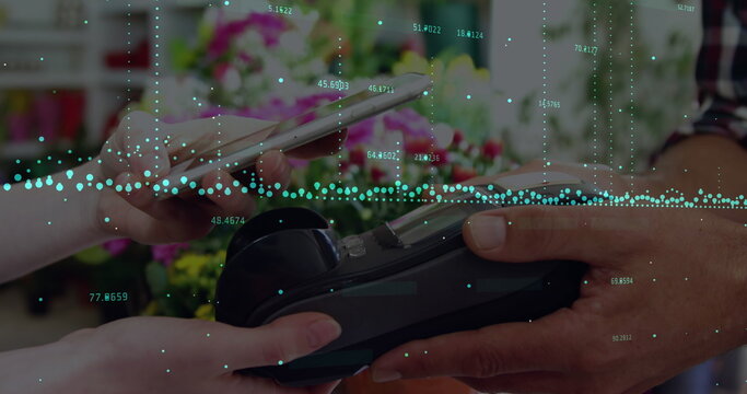 Image of soundwaves with numbers over cropped hands scanning qr code over credit card reader