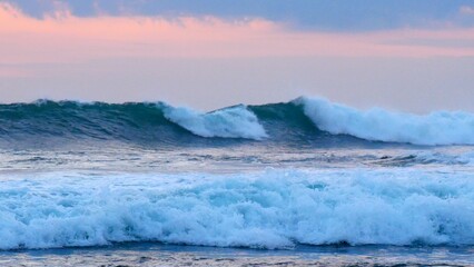 Tropical sea beach in summer time Purple sky on sunny day. Golden sand beach sea peaceful scenery on the beach. Travel vacation seaside outdoor. Ocean island beautiful dramatic Magenta landscape