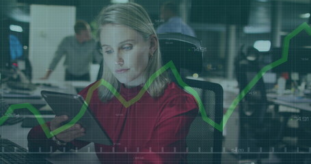 Image of financial data processing with green line over caucasian businesswoman in office