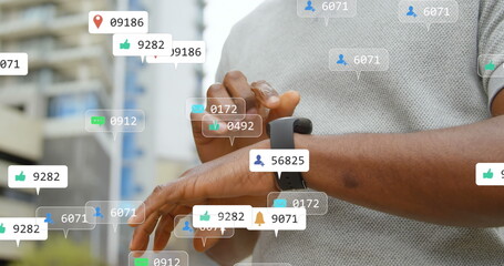 Image of multiple social media icons over mid section of a man using smartwatch outdoors - Powered by Adobe