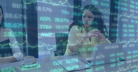 Image of trading board over diverse female manager explaining strategy to coworkers in office