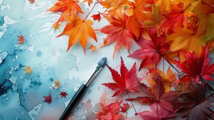 Leaves painted in diverse colors, along with a brush.
