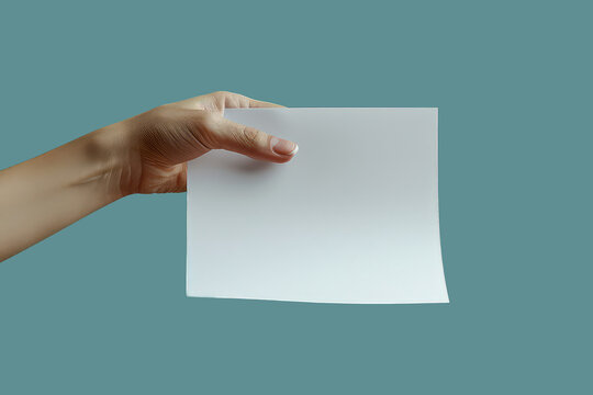 Female hand holding a blank sheet of paper. Isolated on blue background.