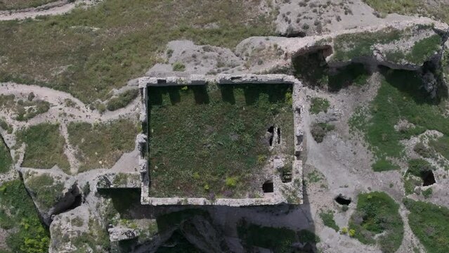 flight with a drone with a top-down view over the keep of the castle of Oreja 9th century we see the shadow of the battlements the earthen roof on the ground remains of its wall Ontigola Toledo