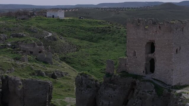 drone flight leaving on one side the 9th century castle of Oreja on the other side there are structures in ruins and this is the hermitage of the depopulated Oreja Otigola Toledo Spain