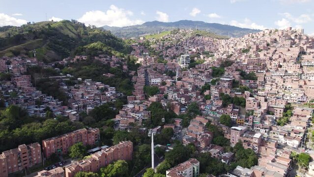 Densely populated homes of Communa 13 and Metrocable in Medellin Colombia, aerial