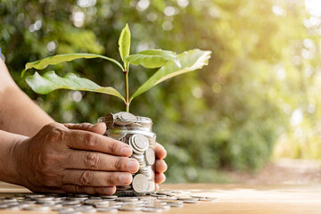 Coins in a clear glass jar money saving concept