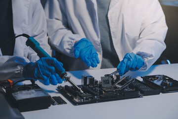 Close up of Technician measuring voltage electronic circuit board television, Service after sale fix electric equipment within insurance.